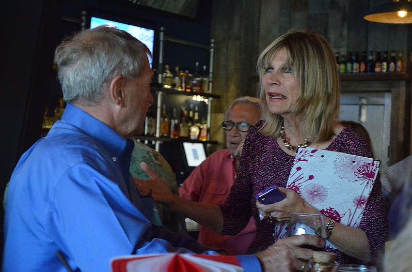 Mayor Suzanne Atwell speaks with supporters during her campaign party.