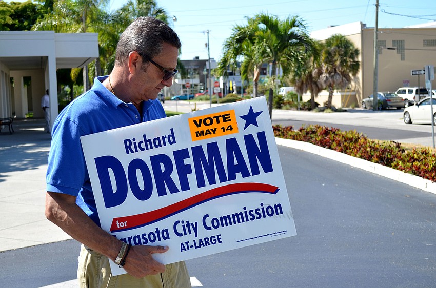 Richard Dorfman checks his phone during Election Day.