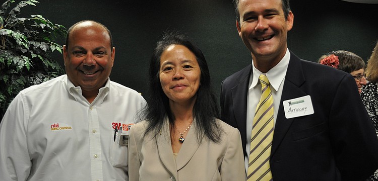 Angelo Ragone of NBI Sun Control, attorney Ann Johnson and Anthony Swart of SunTrust bank