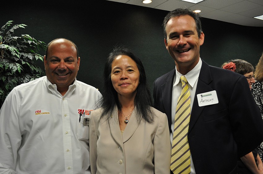 Angelo Ragone of NBI Sun Control, attorney Ann Johnson and Anthony Swart of SunTrust bank