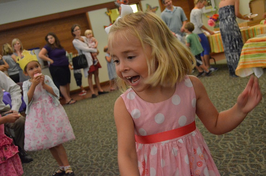Emerson Miller dances to the music at the Butterfly Ball. She will attend Out â€“ of â€“ Door School in the fall for kindergarten.