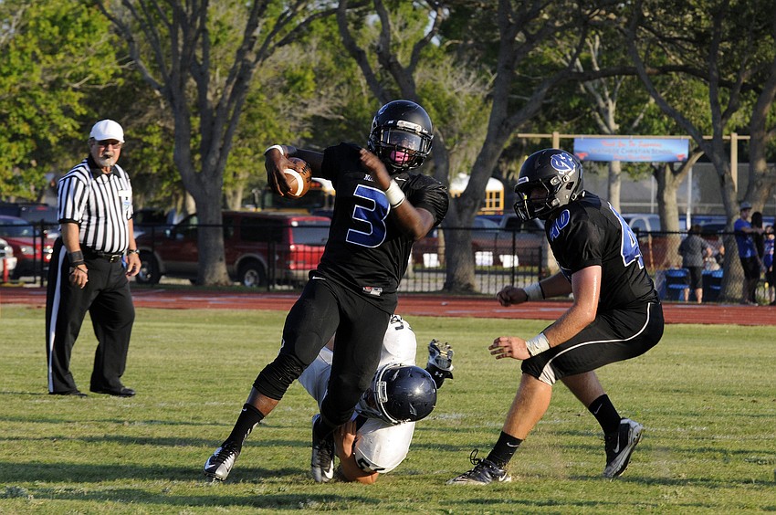 ODA defensive lineman Christian McCarthy wraps up a Northside Christian running back in the first quarter.