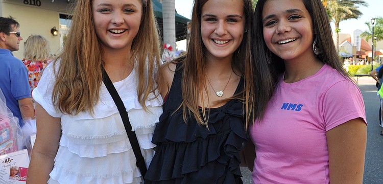 Macy Duregger, Daniella Castrogiovanni and Rachel Levy checked out the auction items.