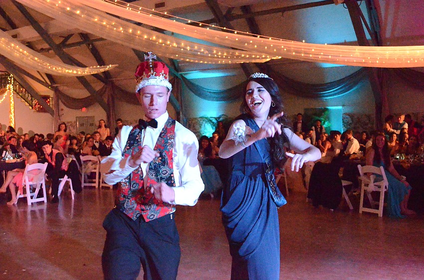 Josh Palmer and Alexis Dinenberg dance together as king and queen.