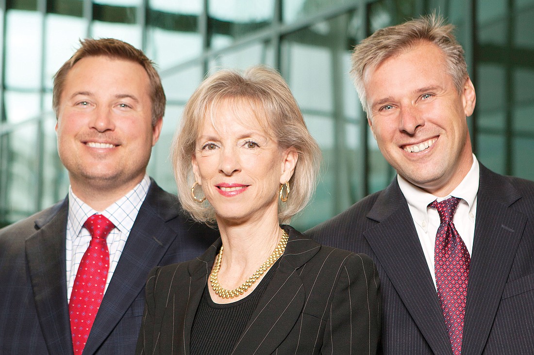 Evan Berlin, far right, founded Berlin-Patten, a Sarasota-based law firm, in 2004. Brenda Patten, middle, joined the firm in 2009 and local attorney, Jamie Ebling, left, was named a partner last year. Photo by Mark Wemple.