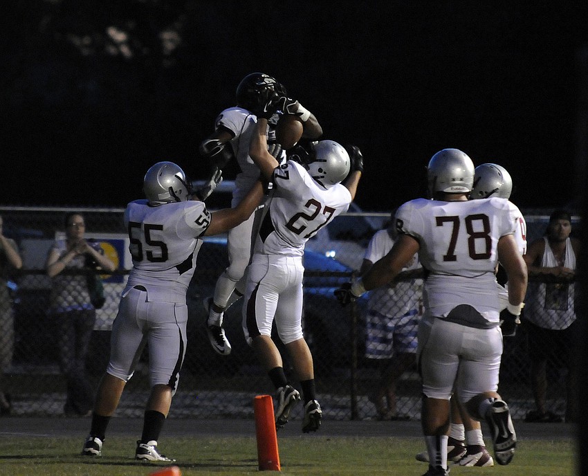 Braden River running back Davion Banks is congratulated following his 2-yard touchdown run in the third quarter.