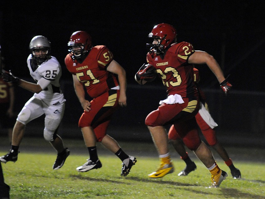 Cardinal Mooney sophomore tight end Mitch Arimura hauls in a pass in the second half.