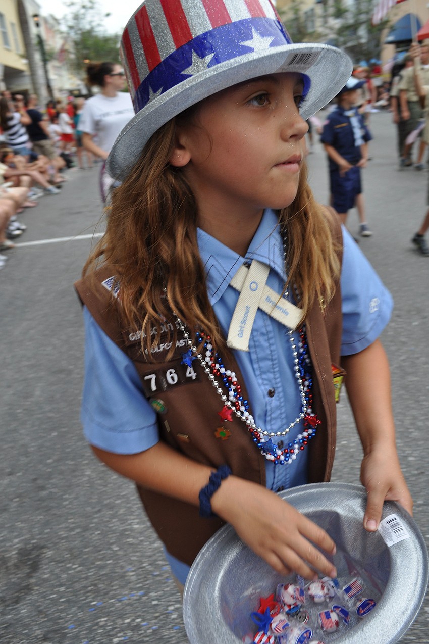 Willis Elementary Schoolâ€™s Nicole Bastidas, 8, passes out candy.
