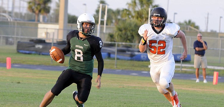 Lakewood Ranch quarterback Chad Rex scrambles for yardage during the second quarter.