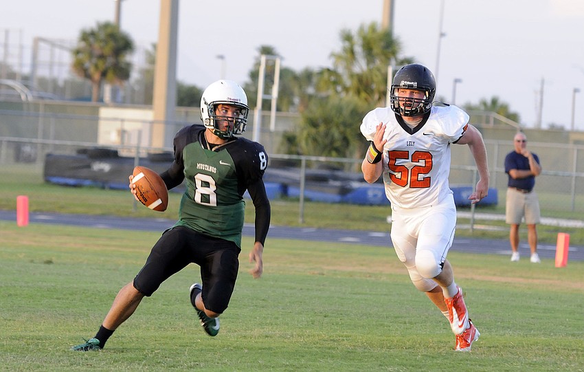 Lakewood Ranch quarterback Chad Rex scrambles for yardage during the second quarter.