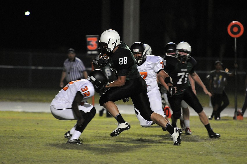Lakewood Ranch junior Wyatt McLeod rushes up the middle for positive yardage in the second half.