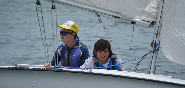 Ethan Heinz and Evan Lemole sail into the squadron finishing off the race.