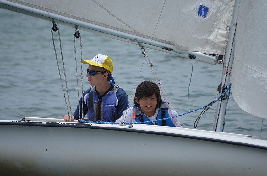 Ethan Heinz and Evan Lemole sail into the squadron finishing off the race.