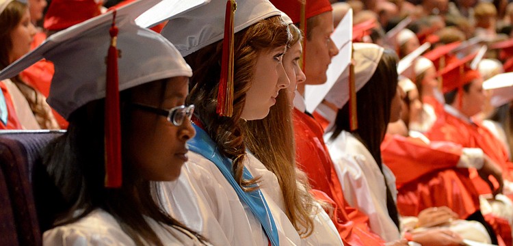 Students listen to the commencement speech.