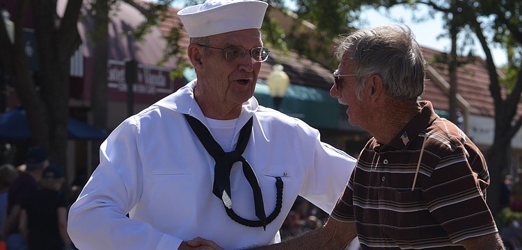 Jim Harney who once served on the USS Princeton thanks veteran Dennis Hauck for his service to the country. Hauck was on the Destroyer in Key West when Fidel Castro took over in Cuba.