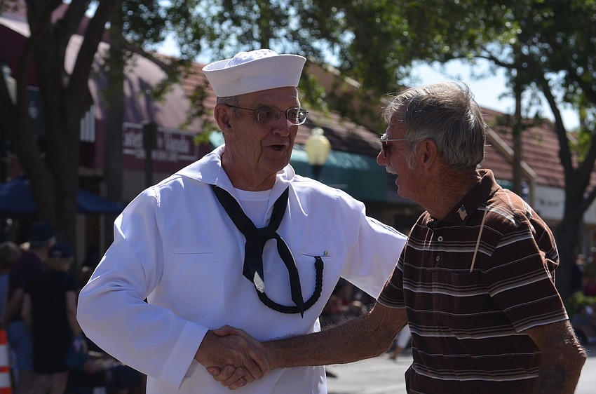 Jim Harney who once served on the USS Princeton thanks veteran Dennis Hauck for his service to the country. Hauck was on the Destroyer in Key West when Fidel Castro took over in Cuba.
