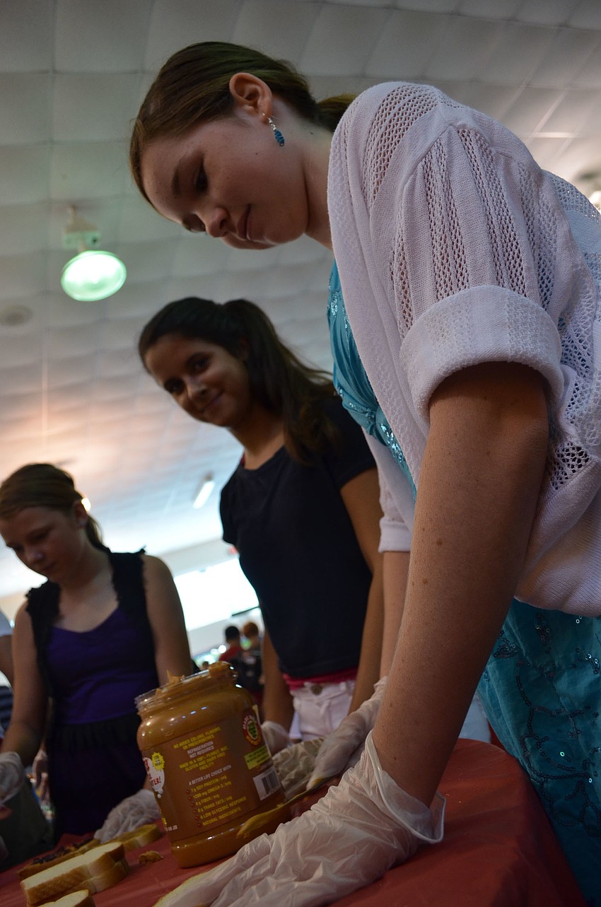 Ninth graders Brady Hill, Ernesto Rendon, Axel Martin, Alicia Neher, Mira Chauhan and Aspen Kaye get ready to make sandwiches.