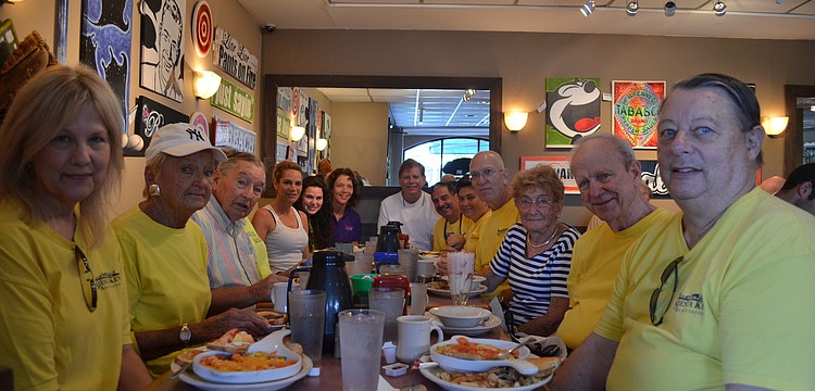 Community members met at Village CafÃ© Saturday morning before the pickup. Village CafÃ© offered free breakfast for people participating in the clean up.