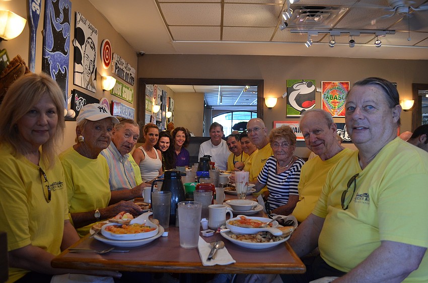 Community members met at Village CafÃ© Saturday morning before the pickup. Village CafÃ© offered free breakfast for people participating in the clean up.