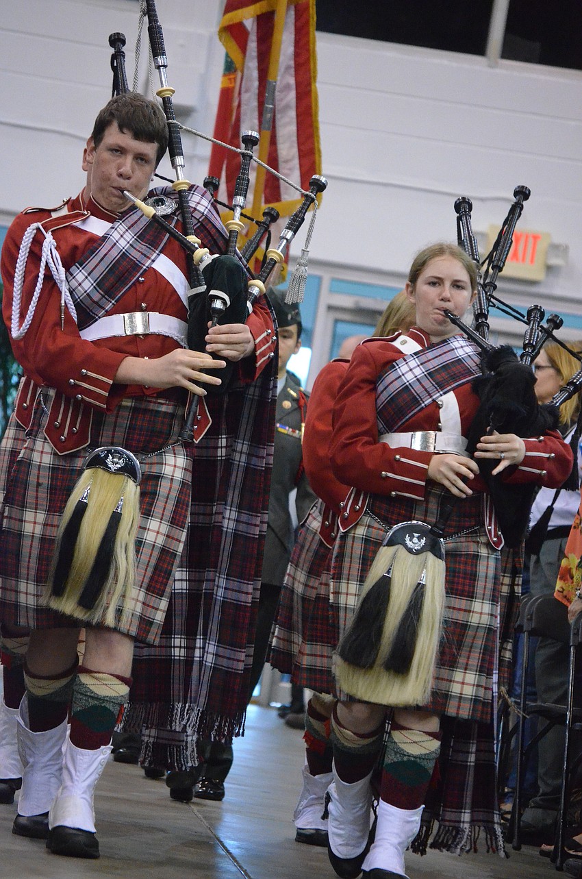 Kiltie Band members James Dennis and Jenny Becker play the bagpipes to begin the ceremony.