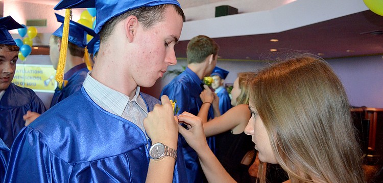 Connor Grooms receives his boutonniere.