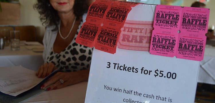 Executive Assistant of the Longboat Chamber of Commerce Victoria Jacobson sold raffle tickets.