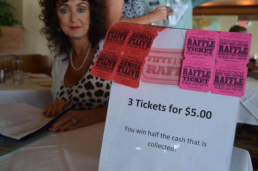 Executive Assistant of the Longboat Chamber of Commerce Victoria Jacobson sold raffle tickets.