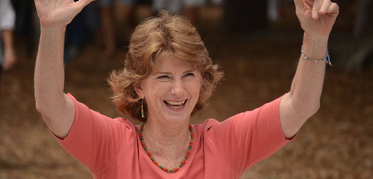 Librarian Glendy Huene greets staff and friends waiting for her at the library. Huene says her retirement is bittersweet.