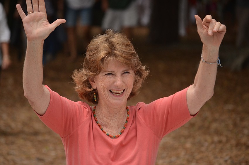 Librarian Glendy Huene greets staff and friends waiting for her at the library. Huene says her retirement is bittersweet.
