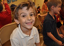 Sammy Miller, 7, found a seat during a game of musical chairs.