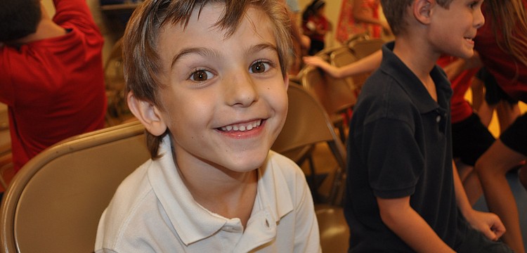 Sammy Miller, 7, found a seat during a game of musical chairs.