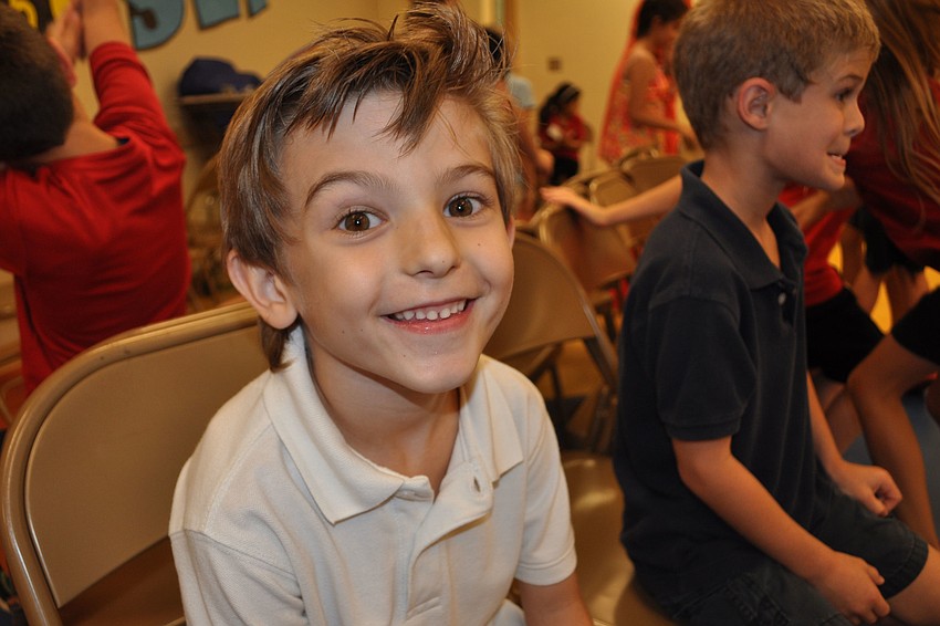 Sammy Miller, 7, found a seat during a game of musical chairs.