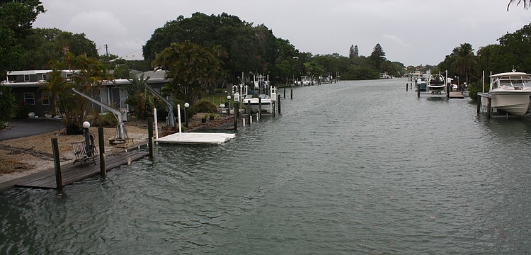 The Grand Canal spills into lawns on Siesta Key just after 2 p.m. Thursday, June 6 â€” four hours after high tide.