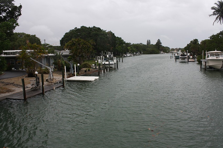 The Grand Canal spills into lawns on Siesta Key just after 2 p.m. Thursday, June 6 â€” four hours after high tide.