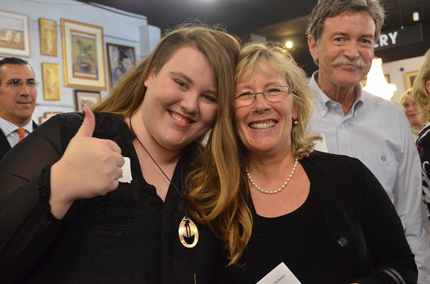 Hannah Gregory hugs her mother Suzanne when her name is announced in the awards ceremony.