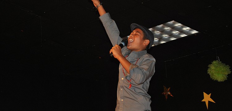 Peter Balos was quite the showman. He sang and hyped up the crowd.