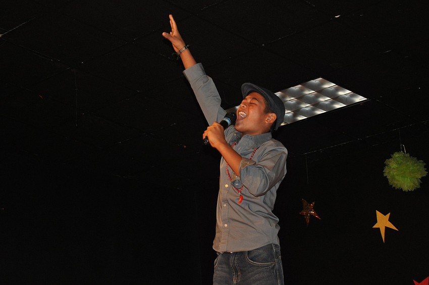 Peter Balos was quite the showman. He sang and hyped up the crowd.