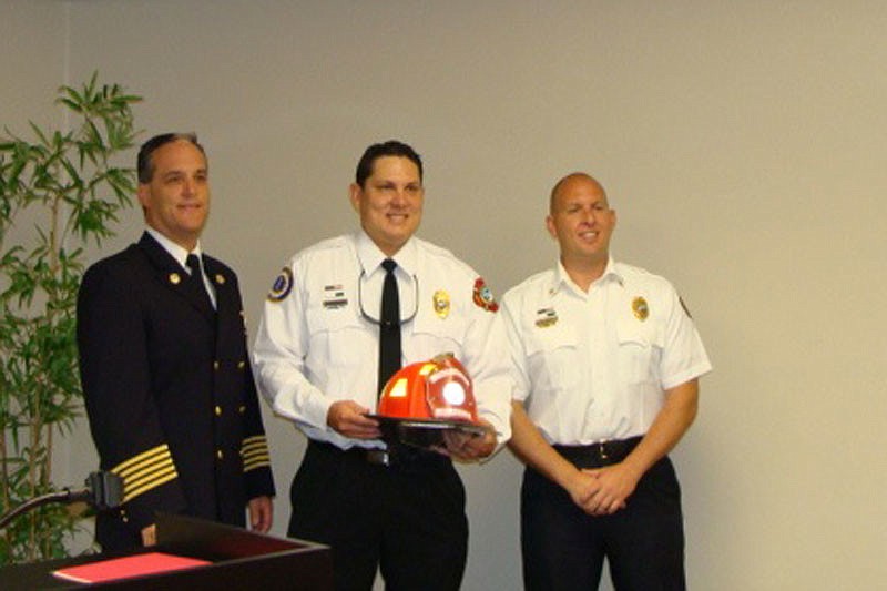 From left, Paul Dezzi, Fire Chief; Lieutenant Jason Berzowski; and Deputy Chief Dave Kyle celebrate BerzowskiÃ¢â‚¬â„¢s promotion Friday at the north fire station. (photo courtesy of town of Longboat Key).