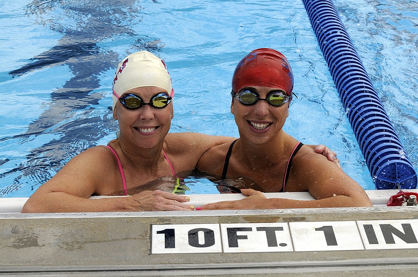 Former Masters teammates Pam McClure and Melissa Massey caught up before the start of the 50-meter breaststroke.
