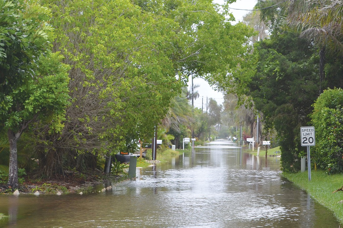 Both Longbeach Village and Sleepy Lagoon streets were flooded after a band of strong winds and rain from Tropical Storm Andrea came ashore June 6. Norton Street looked more like a canal than a street after the storm.