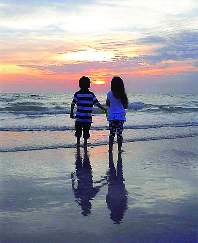 Sheila Dennehy submitted this photo of her 4-year-old twin grandchildren, Finnegan and Riley, enjoying a sunset from Crescent Beach, on Siesta Key.