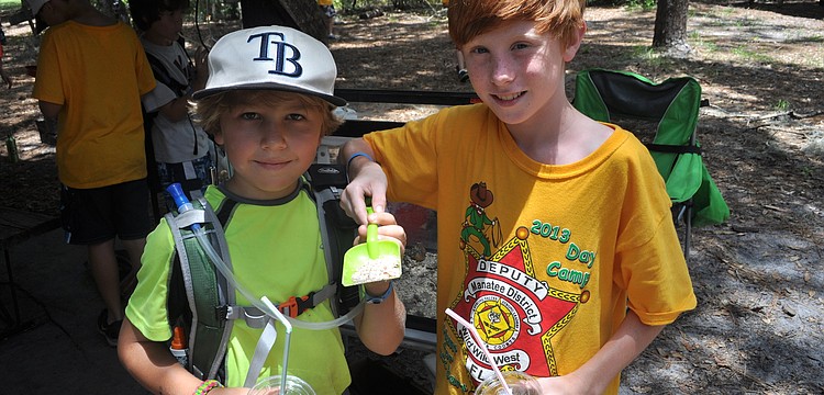 Jack Sanders and Jared Root showed off some mealworms.
