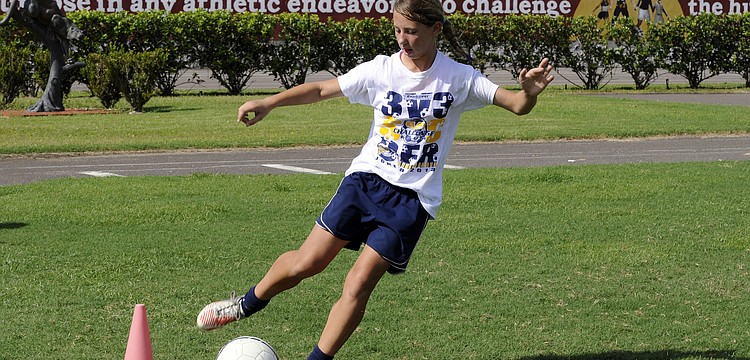 FC Sarasota U13 midfielder Emily Brusco works on her footwork during a trapping drill.