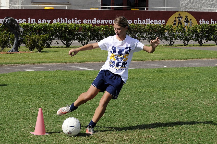 FC Sarasota U13 midfielder Emily Brusco works on her footwork during a trapping drill.