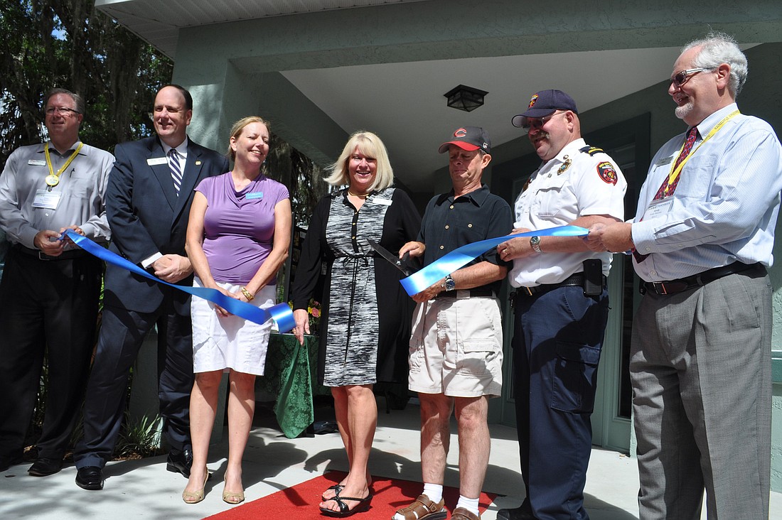 Representatives of the Sarasota Chamber of Commerce and Community Haven for Adults and Children with Disabilities held a ribbon cutting for "Jacquelyn's House" Wednesday.