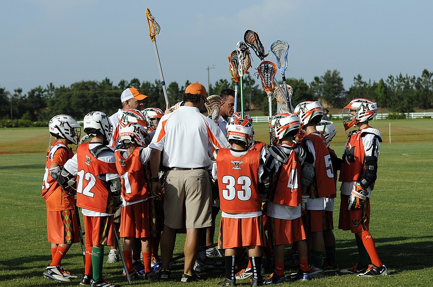 The Manasota Monsters U11 Orange team celebrates following its 8-4 victory over Tampa Elite.