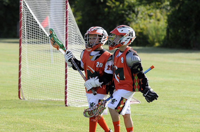 Patrick McGrath and Caden Minniti celebrate following Patrickâ€™s goal in the first half.