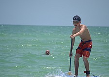 A.J. Grande paddles at the Kids Demo on Siesta Key Beach.