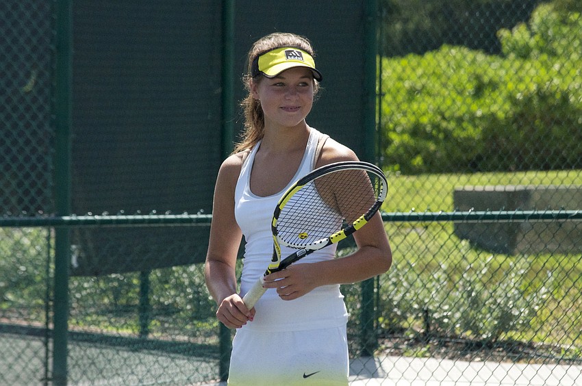 Maddie Allen watches another camper take a serve.