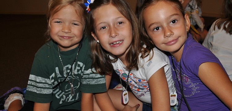 Emma Grace Kelly, Leah Troiano and Parker Haught snack on popcorn.